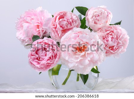 Still life with beautiful pink peonies in green vase Royalty-Free Stock Photo #206386618