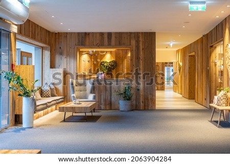 rustic foyer made of old wood and retro furniture with harmonious indirect lighting Royalty-Free Stock Photo #2063904284