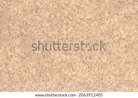 The surface of the sheet is made of cork wood. The texture of a natural cork coating.