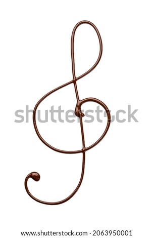 Violin clef made of melted chocolate on white background