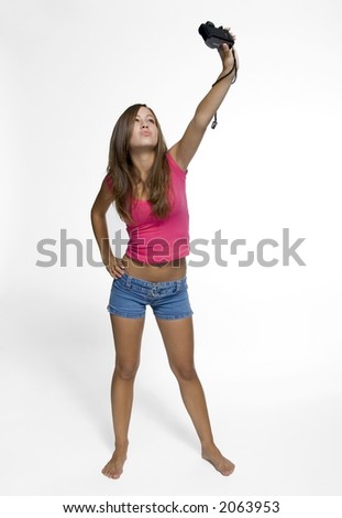teen girl taking a picture of herself