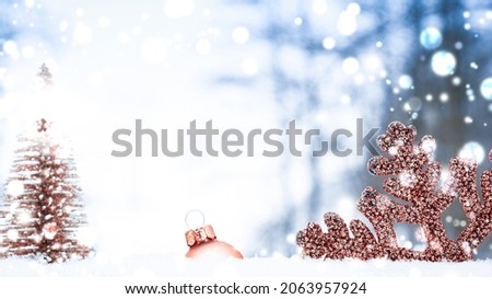 Snowflake background. Christmas holiday tree, golden balls in new year ornament decoration on white winter snow. Merry Christmas holiday card pattern