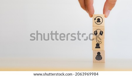 New skill development for business adaptation of technology and digital transformation. Changing skill demand. Hand hold wood cubes re-skill icon with self learning, coaching, knowledge sharing icon. Royalty-Free Stock Photo #2063969984