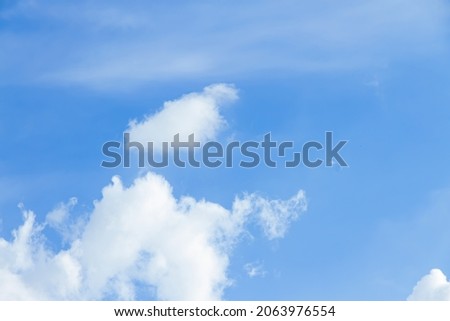 Picture of a clear sky with natural white clouds.