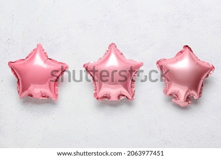 Pink air balloons on light background