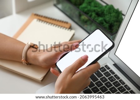 Female hands with modern mobile phone, closeup