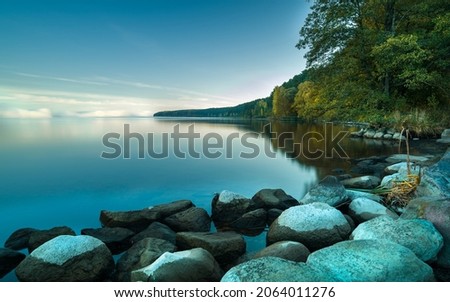 Wonderful morning at Kaunas lagoon sunrise with fog. Autumn colorful trees. Morning serenity, meditation in nature is a wonderful desktop with a view of nature. Lithuania nature is clean and beautiful Royalty-Free Stock Photo #2064011276