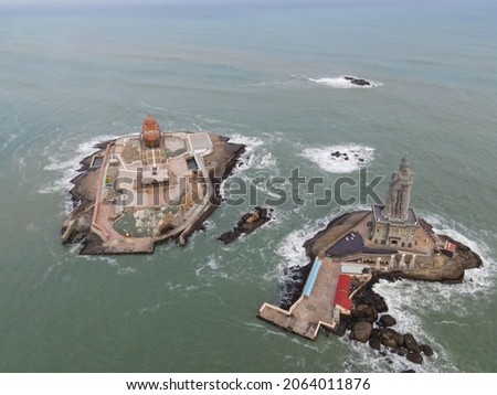 drone shot aerial view top angle photo of kanyakumari seaside Town india southern tip statue seawater waves foam seashore beaches cloudy bright sunny day beautiful scenery natural background 