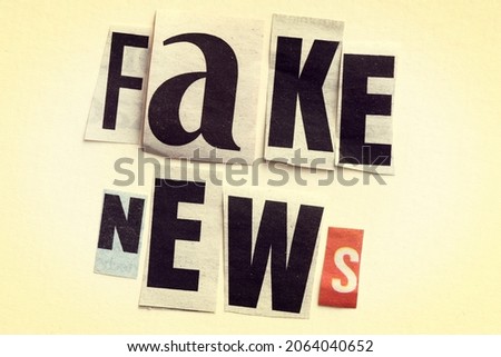 FAKE NEWS word arranged from cut letters from the press. Royalty-Free Stock Photo #2064040652