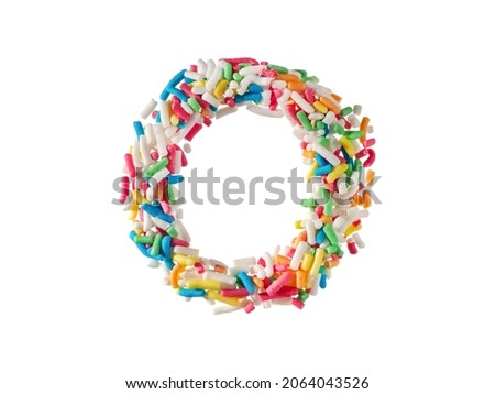 Multi color sugar sprinkles letter O on white background