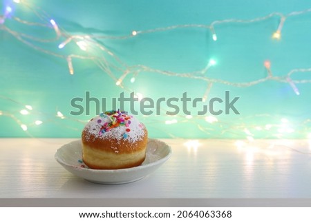 Image of jewish holiday Hanukkah with doughnut