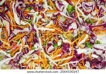 Cabbage salad with carrots close-up, coleslaw salad, vegan salad background. Healthy food from vegetables background Royalty-Free Stock Photo #2064100247