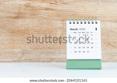 The March calendar 2022 on wooden background. Royalty-Free Stock Photo #2064101165