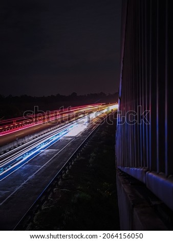 vehicle lights on the highway at night