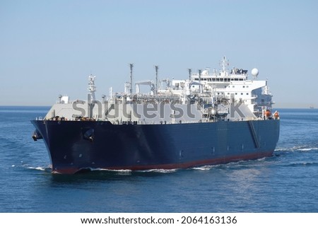 Methane Gas Carrier in the North Sea. LNG carrier Methane Lydon Volney. LNG tanker during sea passage. Royalty-Free Stock Photo #2064163136