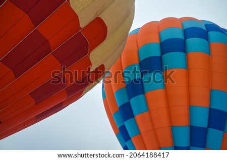 Colorful multi colored hot air balloons soaring with sky background during aeronautic festival