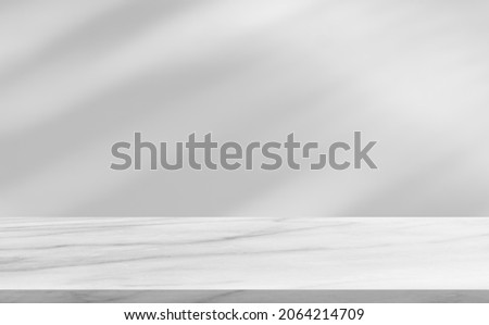 Marble floor shelf stage and blurred shadow leaves tree on wall background well editing display product and text advertising on free space Backdrop