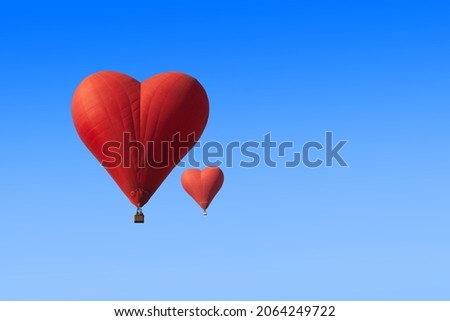 Set of red heart shaped balloon on blue background Royalty-Free Stock Photo #2064249722