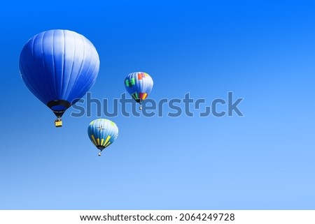 Set of red heart shaped balloon on blue background Royalty-Free Stock Photo #2064249728