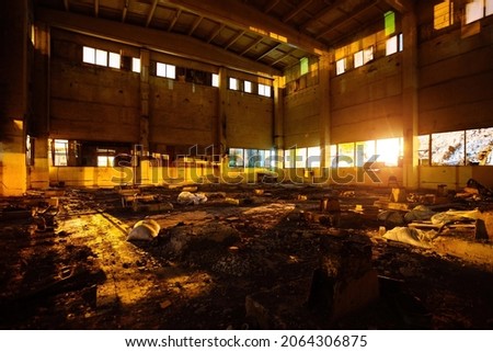 Dark creepy empty abandoned industrial building interior at night. Royalty-Free Stock Photo #2064306875