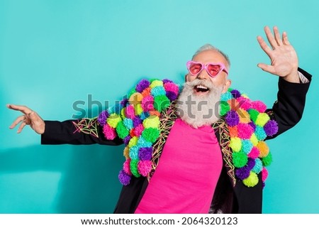 Photo of funny excited mature guy dressed craft pom-pom jacket eyewear smiling dancing isolated turquoise color background Royalty-Free Stock Photo #2064320123