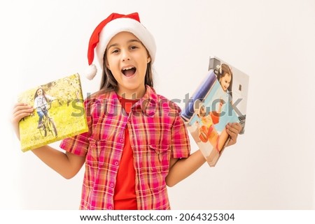 Christmas girl standing with photos on canvas isolated on white
