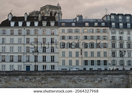 View of typical parisian buildings in front of the river Seine 
