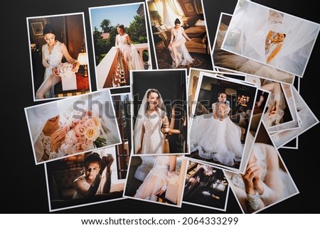 spread out a printed copy of the wedding photos. the result of the photographer's work at the wedding. printed products. a photo session of the bride and groom.