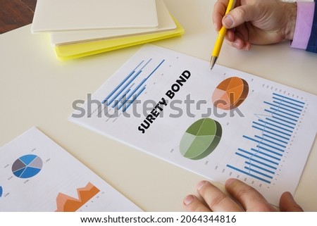 Financial concept meaning SURETY BOND with sign on the laptop. 
 Royalty-Free Stock Photo #2064344816