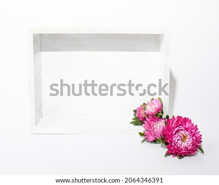 White minimal frame with summer - spring bright pink flower. Nature love concept on white background. Perfect for mother's day or valentine message.