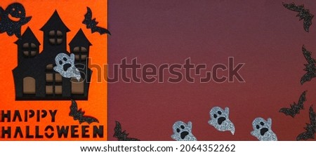 Halloween concept haunted house with bats on a colored background. Halloween October 31st. Close up with copy space. Banner