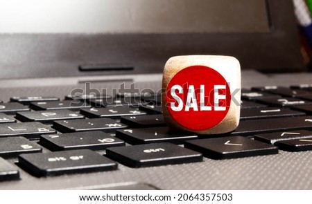 SALE word written on wooden cubes with red letters