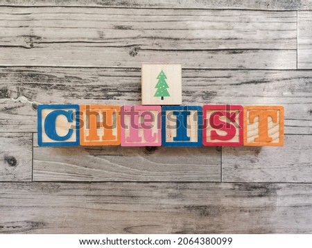 Christ. Christ word and Christmas tree picture from wooden letter blocks. Suitable for educational media for children