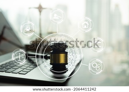 justice legal computer concept. judge gavel and computer on lawyer table with law 
technology icon. Royalty-Free Stock Photo #2064411242