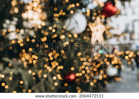 Horizontal blurred Christmas background. Christmas decorated Christmas tree with lights, bokeh