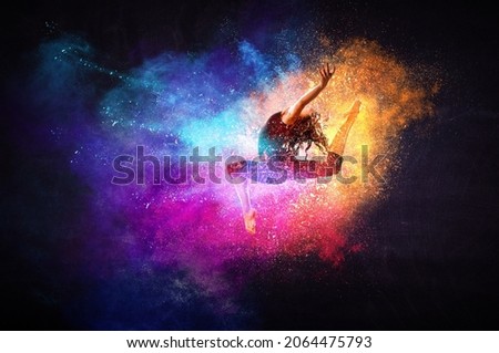 Female dancer against abstract colourful background