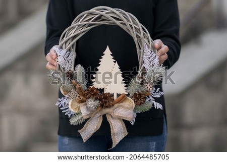 Christmas wreath, on gray stone background. Holidays decor