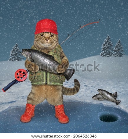 A beige cat fisherman with a fishing rod is fishing on a frozen lake in a winter forest.