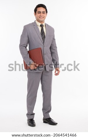 Confident and successful Young businessman on white background.