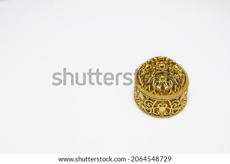 Golden gift box on white background with copy space space.