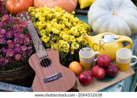 An autumn photo shoot in boat with guitar  Royalty-Free Stock Photo #2064552638