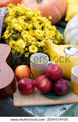 romantic fall autumn date photo shoot  with pumpkin and flowers guitar apples in a boat 