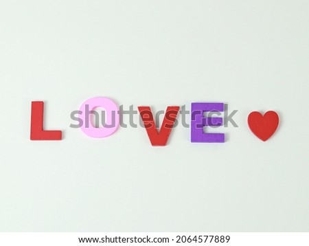 Love word colorful with wooden alphabet on white isolated background