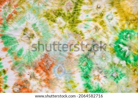 detail of hand-drawn silk scarf with abstract ornament in Tie-dye batik technique Royalty-Free Stock Photo #2064582716