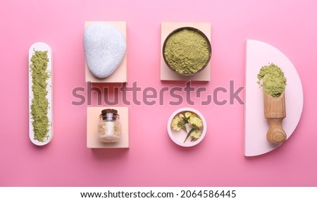 Composition with dry henna powder on color background
