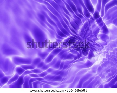 Closeup​ blur​ abstract​ of​ surface​ blue​ water. Abstract​ of​ surface​ blue​ water​ reflected​ with​ sunlight​ for​ background.Top​ view​ of blue​ water.​ Blue​ abstract​ for​ graphic​ design.