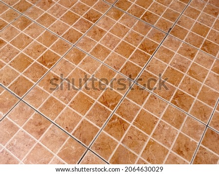 Orange marble tile floor texture pattern background 