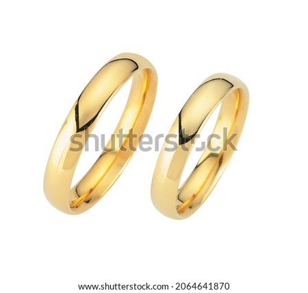 The gold wedding rings isolated on white, wedding rings concept.
