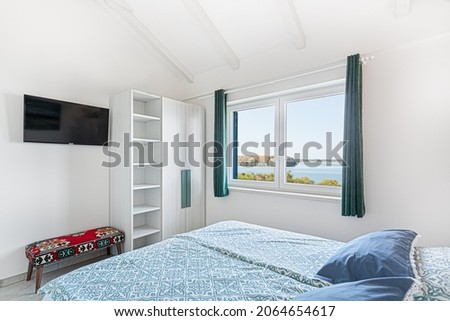 Bedroom with bright seaside view
