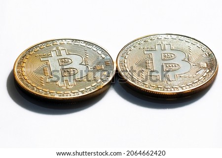 Two bitcoins on a white background